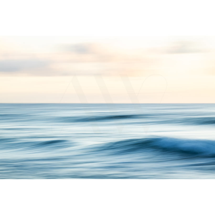 Coolum Beach Image 0260 by AWP Image Library captures a tranquil seascape with soft waves under a pale sky, blending blue and light hues for a serene, abstract quality and calming atmosphere.