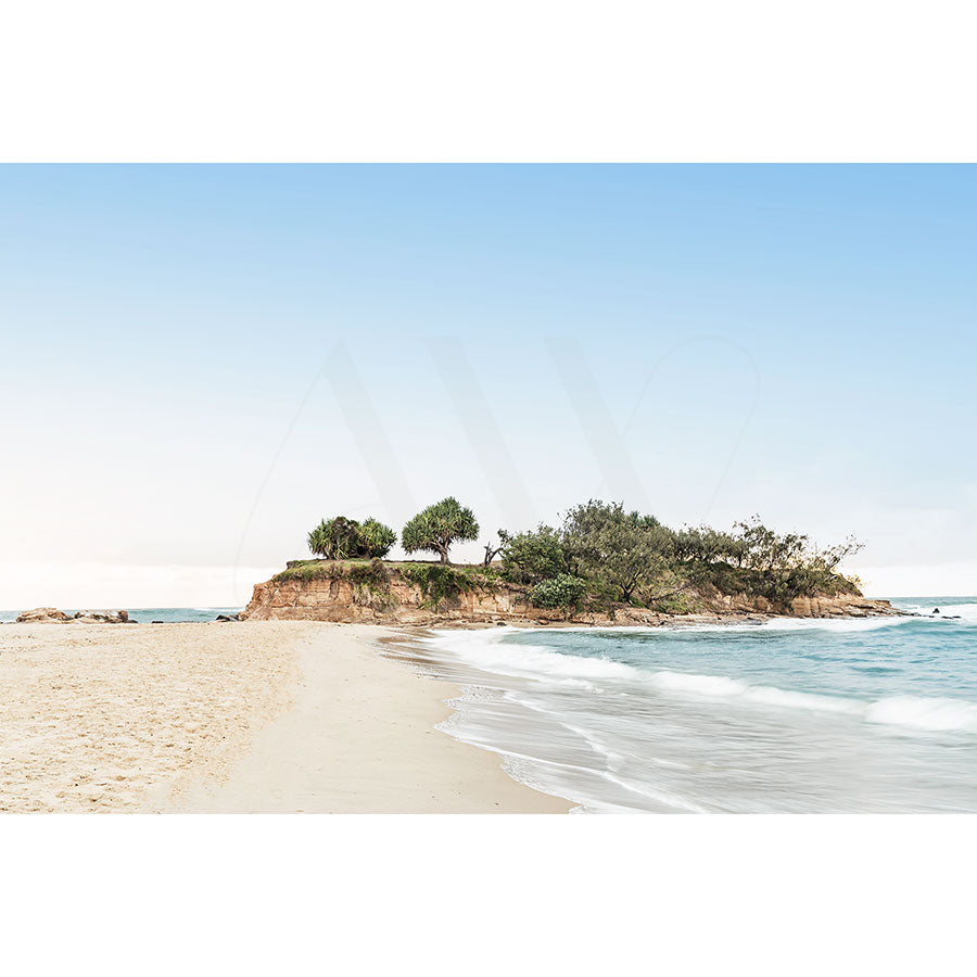 Pincushon Island Image 9398 from AWP Image Library captures a rocky, tree-covered island off Mudjimba, framed by sandy shores and gentle waves beneath a clear blue sky.